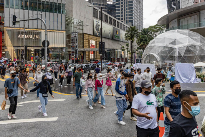 Malaysia records major drop in new Covid-19 cases with 26,250 infections, 77 deaths
