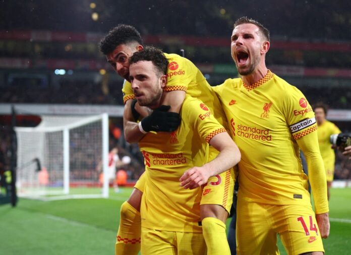 Liverpool sink Arsenal to boost title bid, record-breaker Kane lifts Spurs