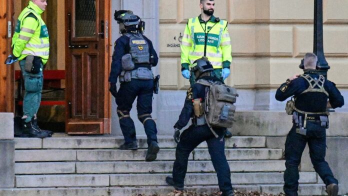 Two die in Swedish school attack, student suspected: police
