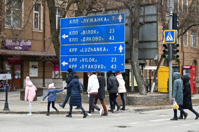 Ukraine border town sees refugee influx, Hungarian exodus