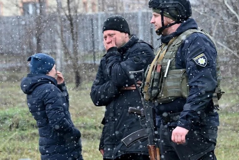 Bucha mourns at mass graves in wreck of Russian retreat