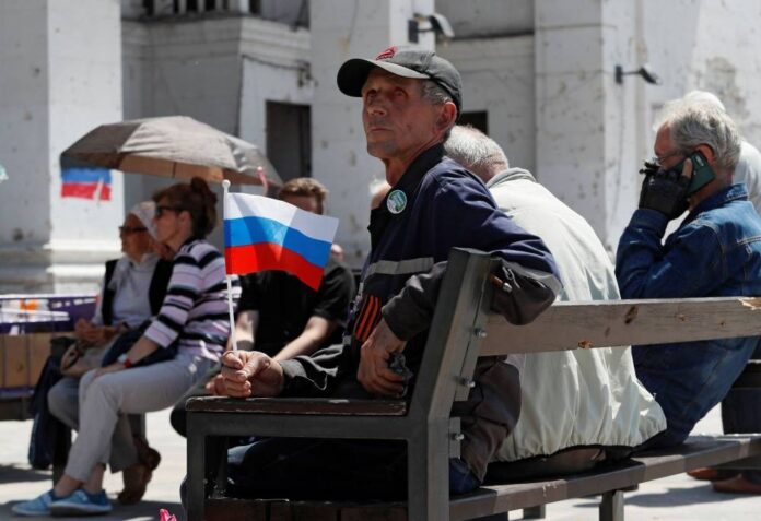 Life in Ukraine's post-siege Mariupol: Barter markets and Russian TV