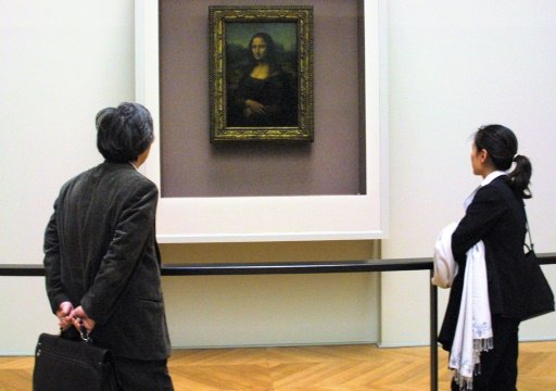 Man arrested after smearing Mona Lisa with cake at Louvre