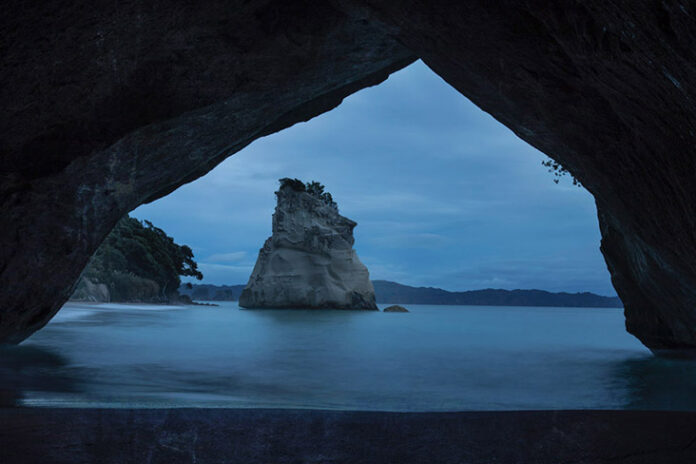 Before sunrise: Enter a magical realm at Cathedral Cove, a hidden piece of Narnia in New Zealand
