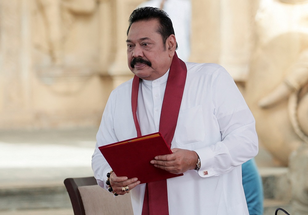 Outgoing Sri Lankan PM evacuated by troops