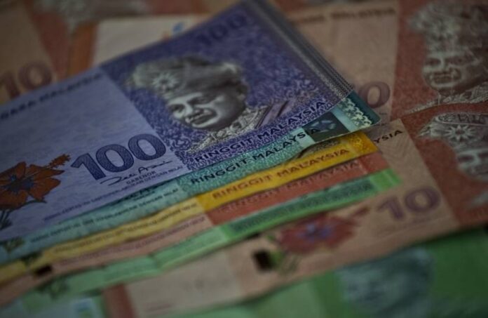 Report: Some Malaysian employers cut workers' benefits after wage floor raised to RM1,500