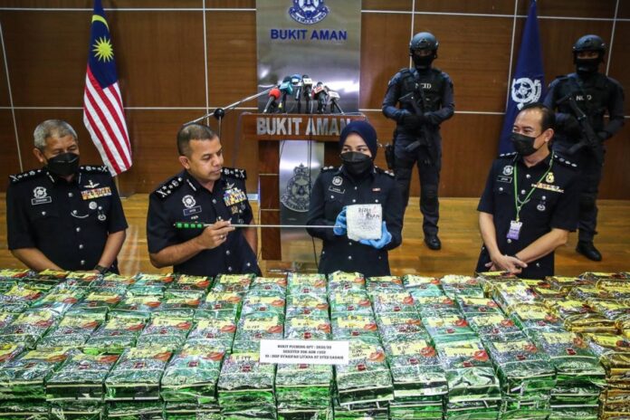 Top narcotics buster says Malaysia's drug laws need updating to fit the growing global trade