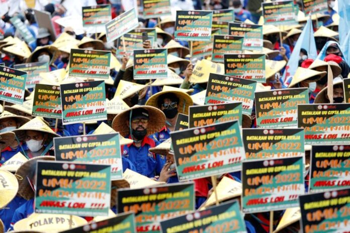 Indonesia seeks to preserve controversial jobs law, parliament set for debate