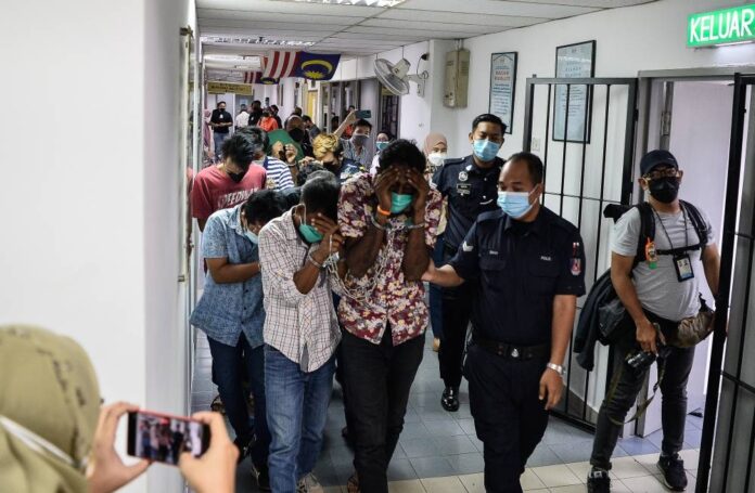 Ten men fined RM1,000 each for having RM3.14m belonging to a teacher in their bank accounts in Ampang