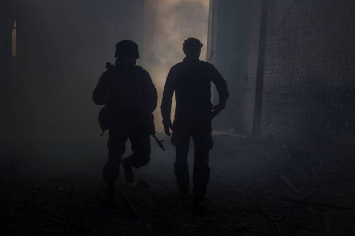 Ukraine sends reinforcements into city besieged by Moscow