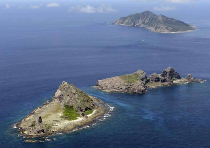 Japan protests Chinese navy sailing near disputed islands