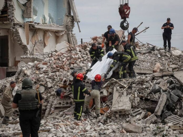 Death and devastation as Russian rockets hit Ukraine apartment block, say local officials