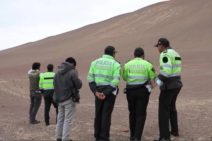 Tourists trample all over protected, prehistoric Peruvian hill carving