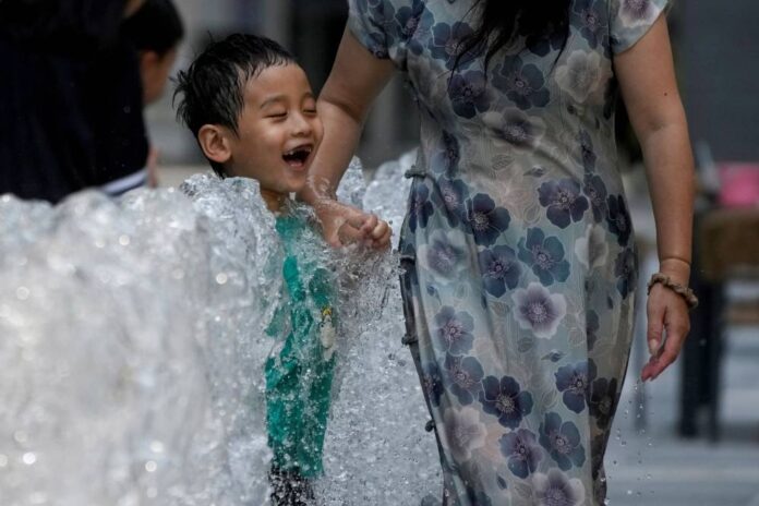 Chinese cities break heat records, weather extremes to persist