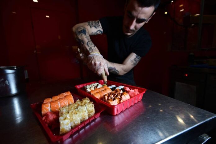 'War is war' but Ukraine sushi bar serves lunch on time