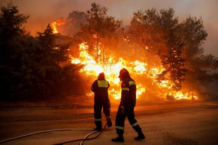 Wildfire rages near Athens; homes damaged, hospital evacuated