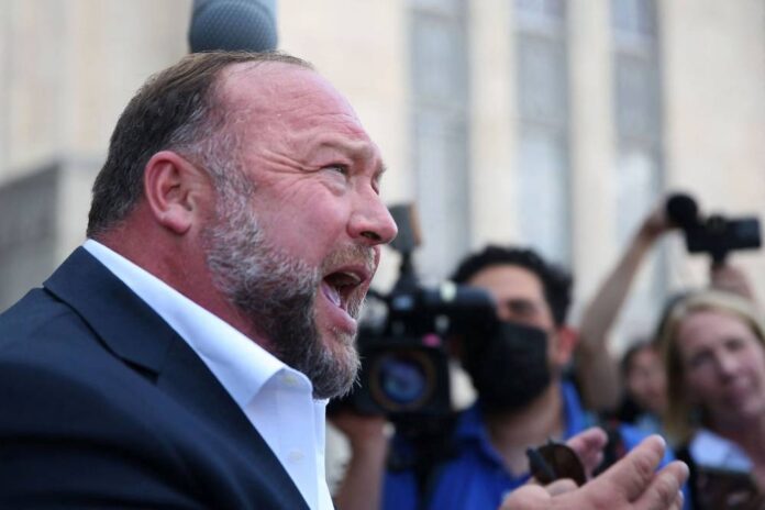 Alex Jones says his Sandy Hook hoax claims were 'crazy' amid defamation trial