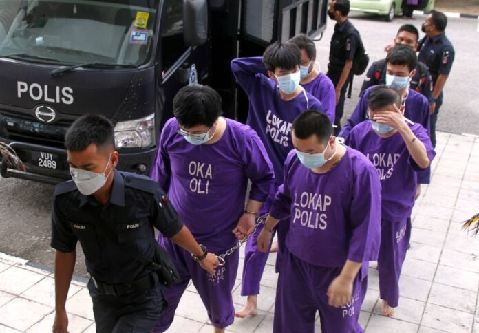In Perak, two Chinese nationals fined, five plead not guilty to entering Malaysia without valid documents