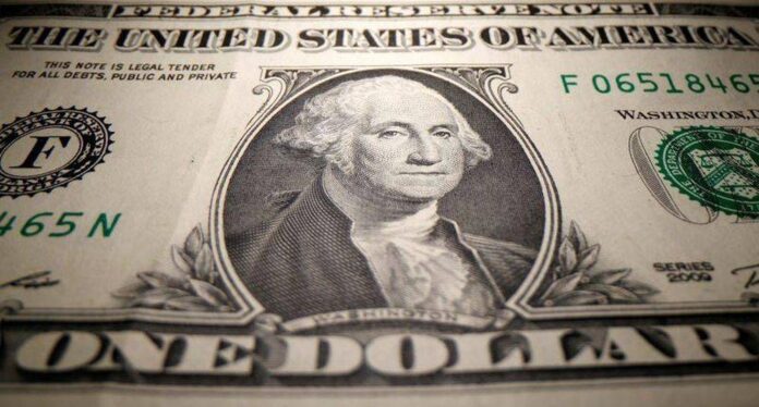 Dollar slides further after US inflation surprise