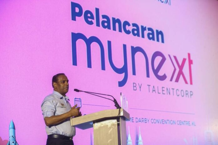 HR minister says will investigate claims employers forcing foreign workers to bear costs