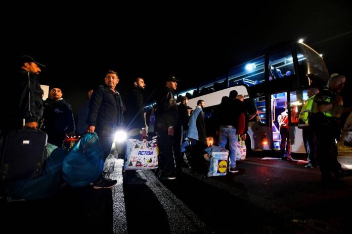 Dutch bus out asylum-seekers at crisis-hit centre