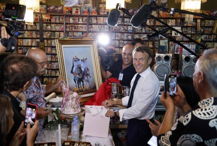 Macron visits famed Disco Maghreb record shop on Algeria trip