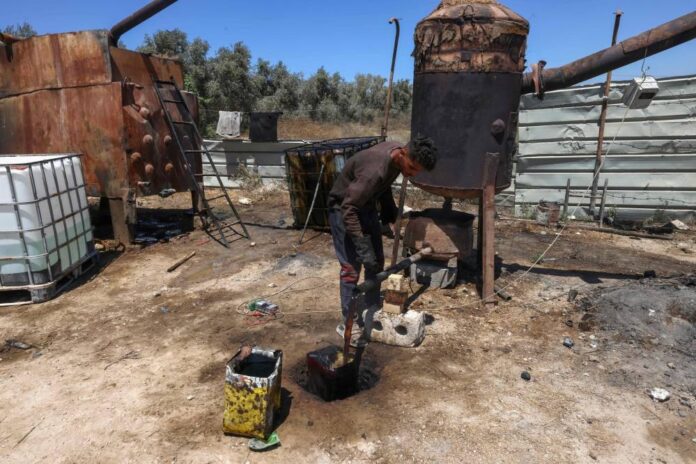 In risky recycling venture, Gazans burn plastic for fuel