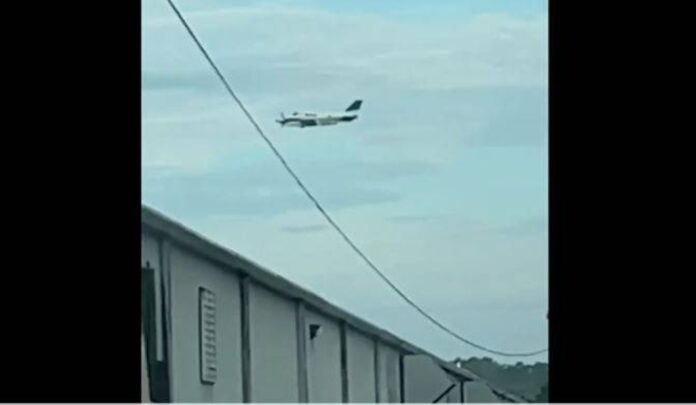 Small-plane pilot held after threat to crash into US store