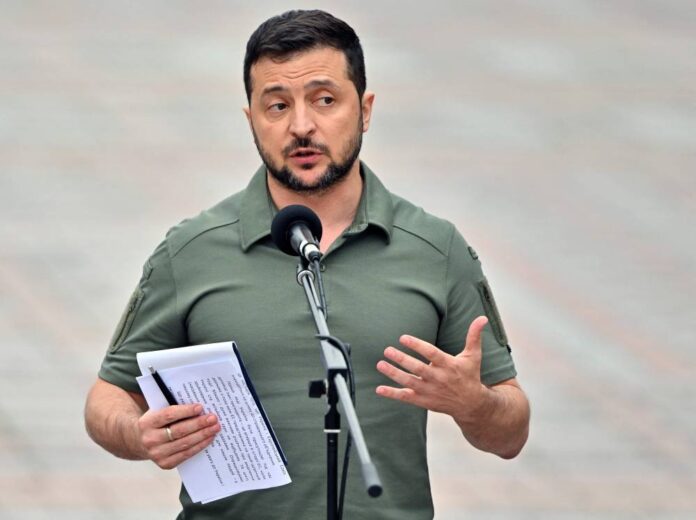 Ukraine reveals discovery of mass grave as US announces new aid