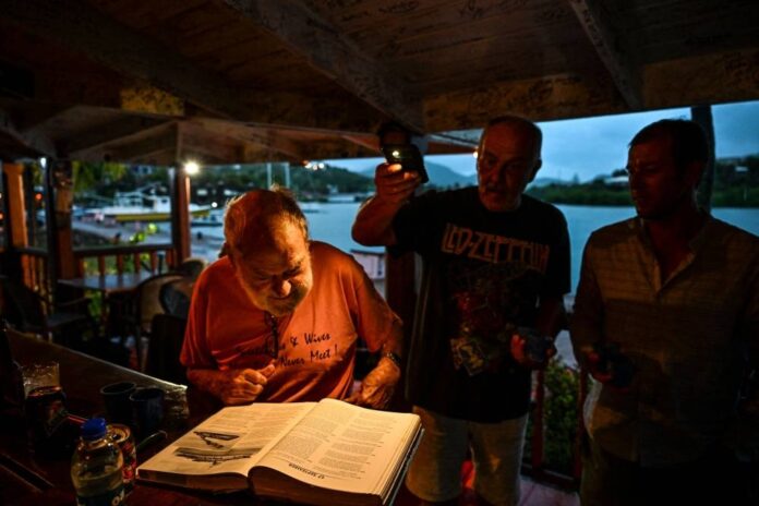 With a tot and a toast, Antigua's loyalists remain true to Charles