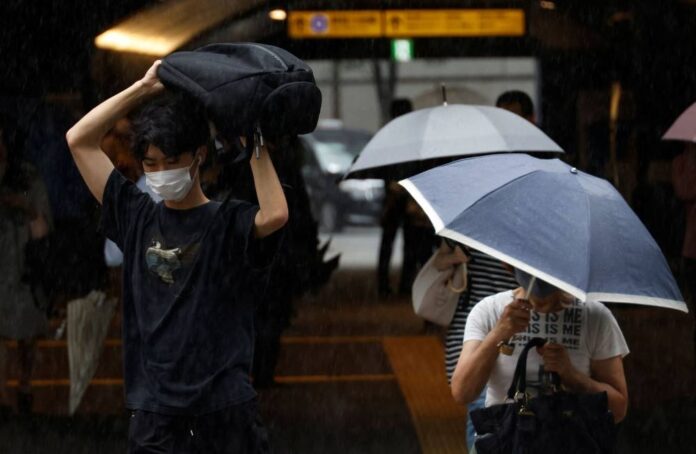 Typhoon lashes central Japan, killing two