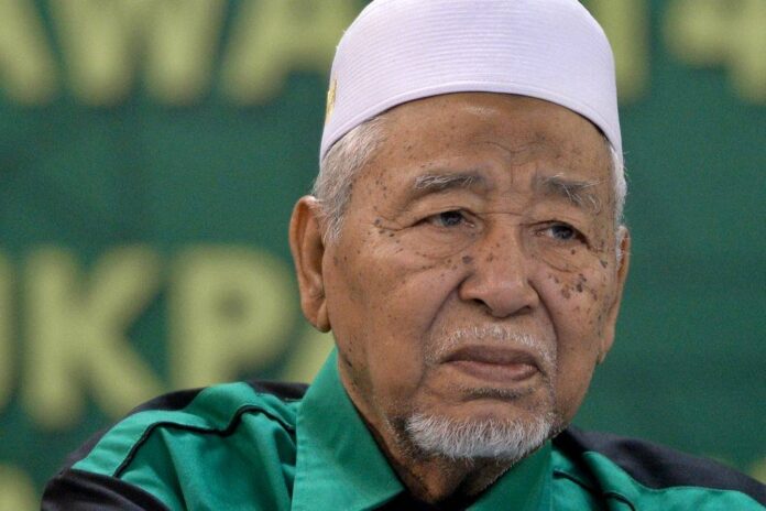PAS spiritual adviser tells ally Muhyiddin to work with Umno instead of against it in GE15