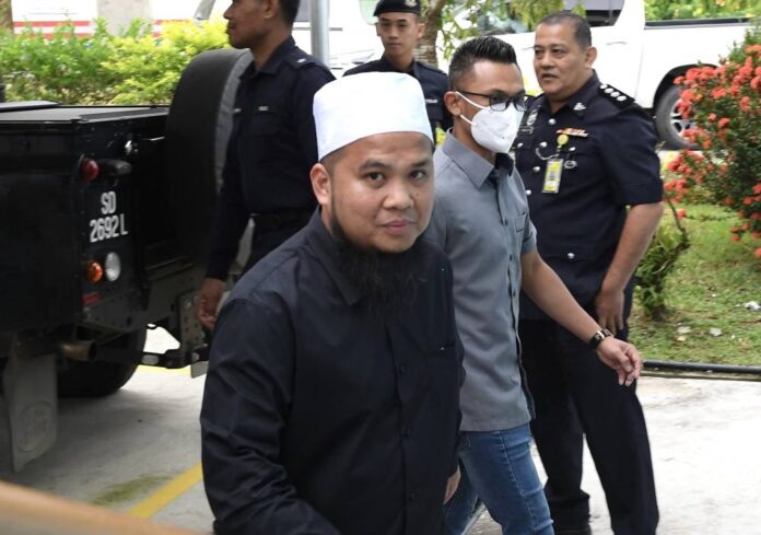 Preacher Ebit Lew trial: Police officer seized handphone without checking contents, court hears