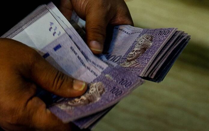 Does Umno care that Malaysians have to pay more due to weak ringgit? Guan Eng asks