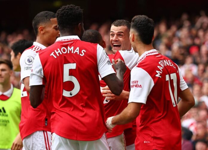 Arsenal stay top with derby win as Tottenham self-destruct