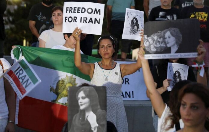 Iran lawmakers chant 'thank you, police' amid growing public fury over woman's death