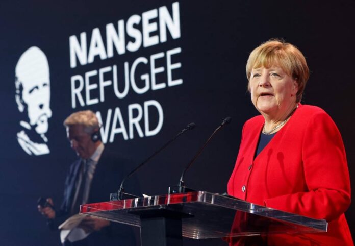 'Respect refugee rights', Merkel tells leaders as she accepts UN prize