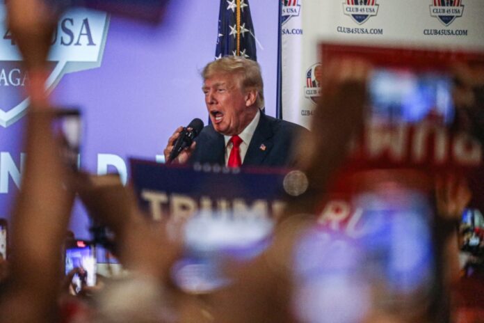 US grand jury member says charges recommended in probe of Trump, allies