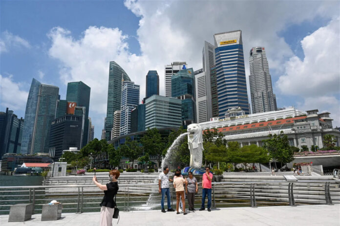 Singapore police investigate bomb threats at 18 locations