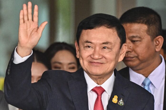 Thai king cuts ex-PM Thaksin's jail term to one year