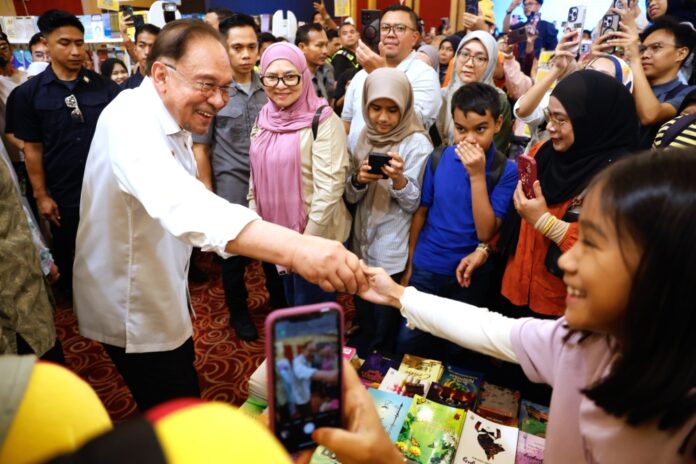 Anwar defends Tengku Zafrul’s role in investment and trade portfolio, set to stay on as minister despite Umno exit