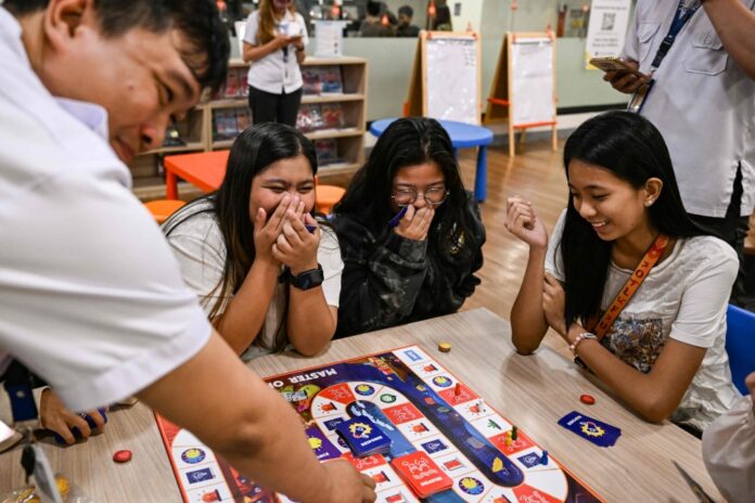 Filipinos master disaster readiness, one roll of the dice at a time