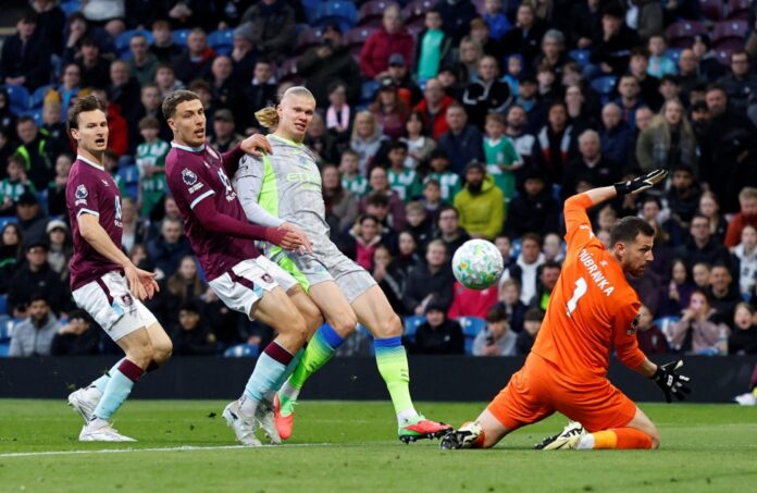 Manchester City go top of Premier League as Burnley relegated