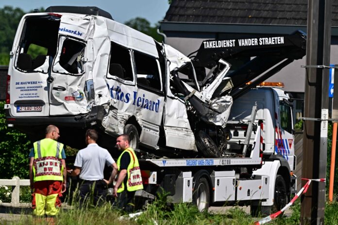 Four killed after train crashes into school minibus at Belgian rail crossing