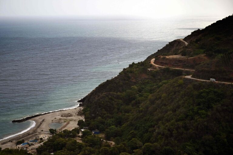 From cracked walls to empty beaches, Venezuelan villagers survive on aid and rationed fish